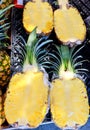 Unmarked beautifully colored sliced Ã¢â¬â¹Ã¢â¬â¹pineapple on store shelves in a supermarket